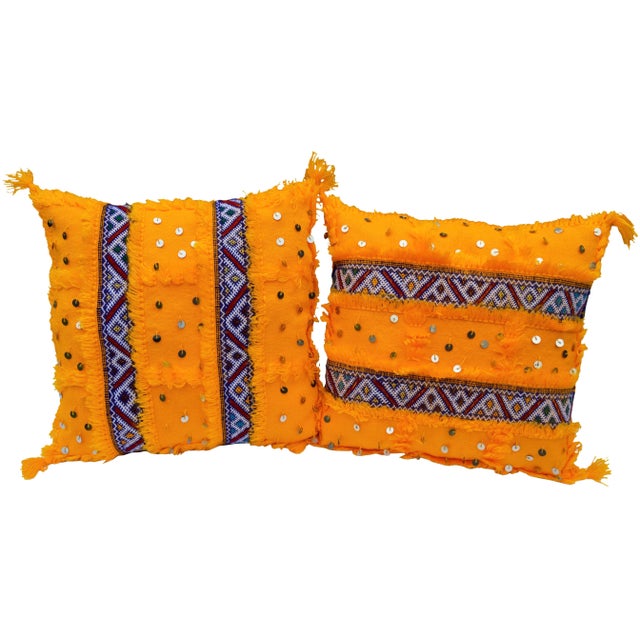 Vintage pair of Moroccan silk and wool pillows handwoven in a lively and vibrant orange color, by the Berbers of the High...