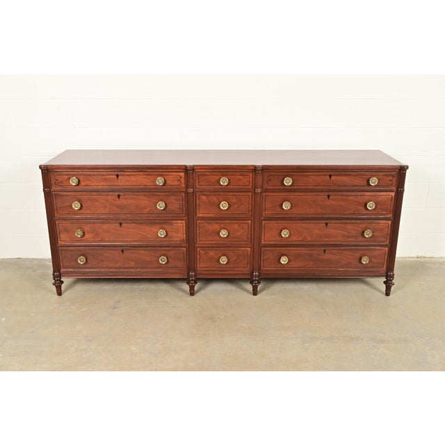 A gorgeous French Regency Louis XVI style twelve-drawer triple dresser or credenza By Kittinger USA, Circa 1960s Beautiful...
