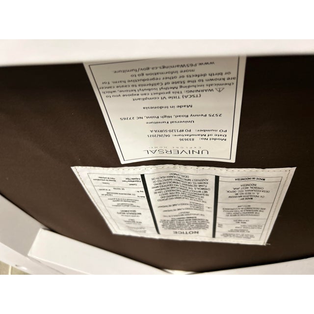 Coastal dining chairs crafted with woven abaca back and upholstered seat finished with tapered legs in a white finish. In...