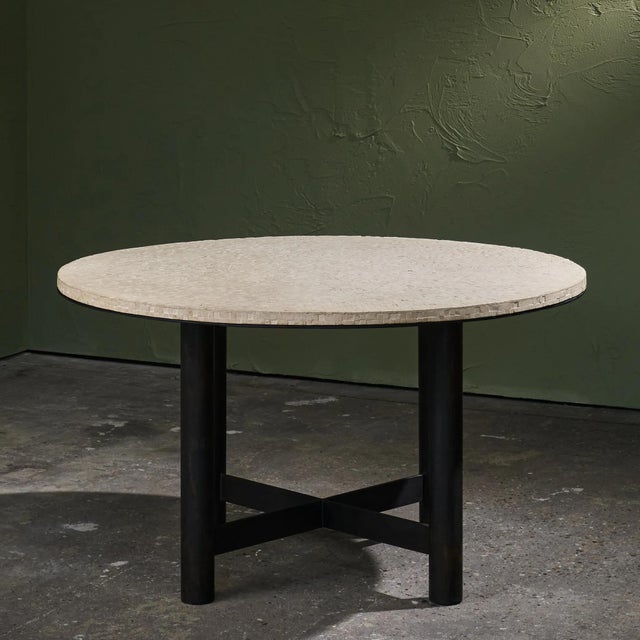 Large scale center or dining table with a limestone mosaic top, composed in a refined circular pattern. The surface...