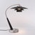 The Boomerang Table Lamp is a Modern table lamp crafted with a sleek silhouette, combining a Black Oak and Satin Nickel...