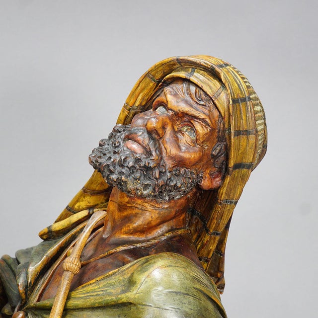 Wooden Carved Sculpture of a Coffee Drinking Arab, Vienna Ca. 1900 A masterly carved wooden statue of an Arab drinking...
