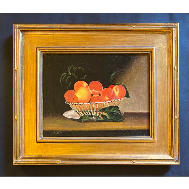 Still life oil painting on hand stretched linen of peaches in a basket by Satori Gregorakis. Signed in the lower left...