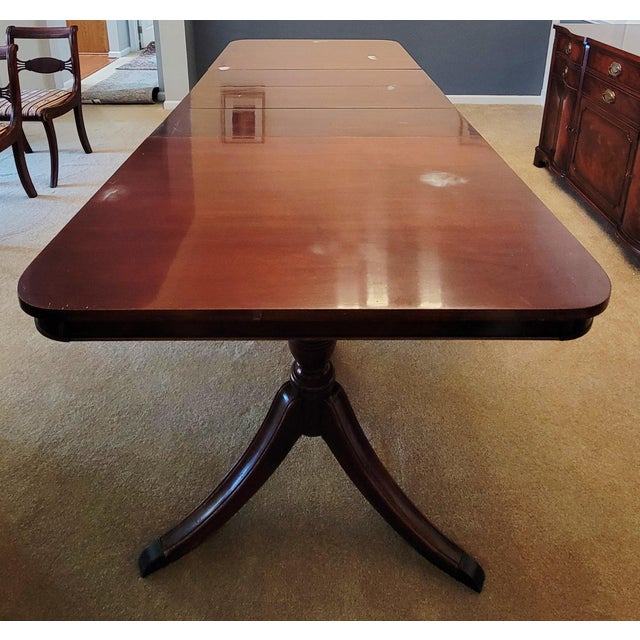 Vintage Chippendale flame mahogany double pedestal dining table, 62 in wide without leaves, 98 in with all 3 leaves. Heat...