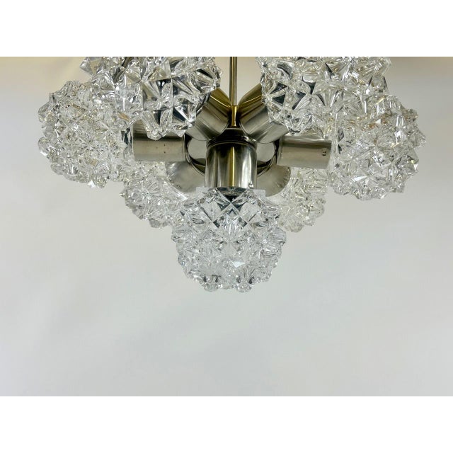 Mid-Century 7-Arm Chandelier from Kamenický Šenov, 1970s, in Restored conditions. Designed 1970 to 1979 This piece has an...