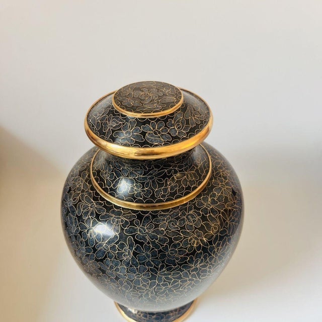 This elegant, baluster-shaped lidded jar is crafted in the traditional cloisonné enamel technique on a copper base. The...