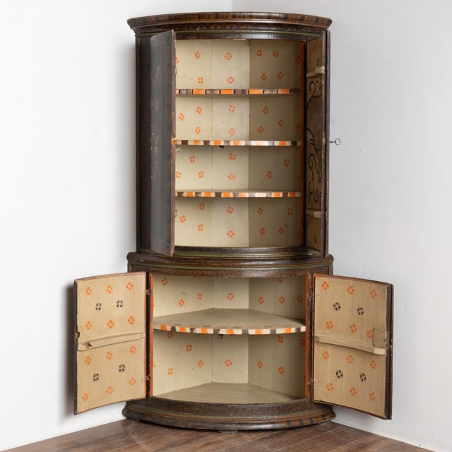 Original 19th-century Swedish pine corner cabinet dated 1846, featuring its original hand-painted folk art finish. The...
