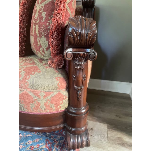 1940's hand carved mahogany sofa with brocade upholstery. Very good condition. Pair of matching lounge chairs available....