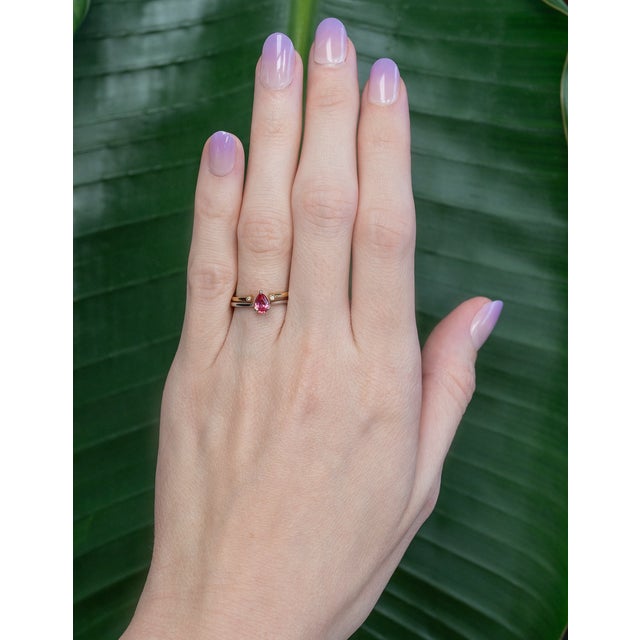 Two earth-mined diamonds run across this solid 14K yellow gold open band. The hardest natural material, diamond has...
