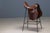 This distinctive pair of bar stools combines saddle-inspired leather seating with a minimalist metal structure. The design...