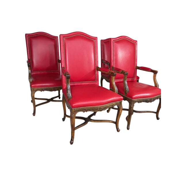 A nice set of 4 Louis XV-style armchair (dining) chairs. Beautifully upholstered in red leather. The back leather is set...