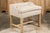 An English stool from circa 1920 with slightly raised back, straight carved legs, H-Form cross stretcher and newly...