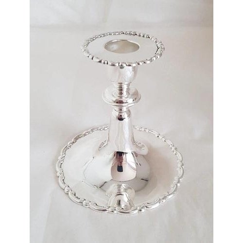 A fine pair of antique English sterling silver candlesticks by the celebrated Elkington & Co. Ltd, hallmarked in London...