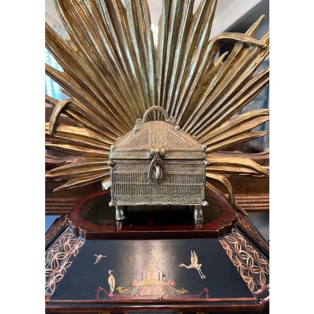 This brass money box is from the Dhokra Damar tribes of Orissa in North East India. This style of Dhokra work dates to the...