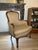 A charming vintage French Louis XV–style armchair featuring a beautifully carved wood frame with floral detailing,...