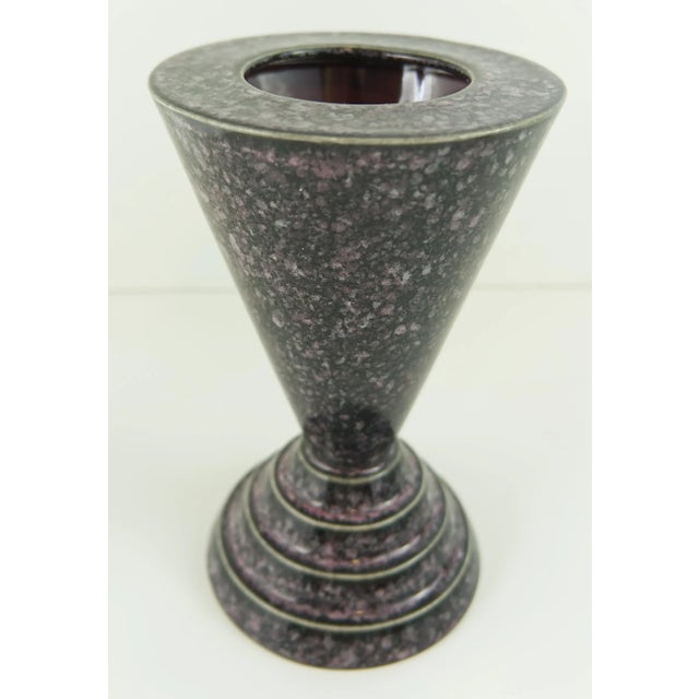Designed and crafted by husband and wife Tyrone and Julie Larson, this Postmodern cone shaped ceramic vase, features a...