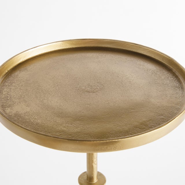 With an antique brass frame and a petite surface, this charming accent table is made for modern living. Move it...