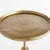 With an antique brass frame and a petite surface, this charming accent table is made for modern living. Move it...