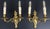 An elegant pair of Vintage French sconces featuring beautifully ornate scrolling arms and decorative detailing throughout....