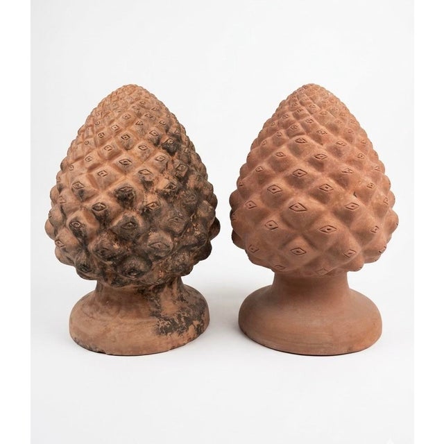 This striking pair of Italian terracotta finials features the classic Pigna (pinecone) motif, a traditional Mediterranean...