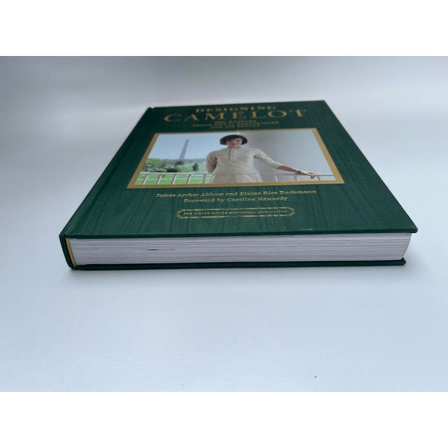 A single hardcover coffee table size book titled Designing Camelot: The Kennedy White House Restoration by authors James...