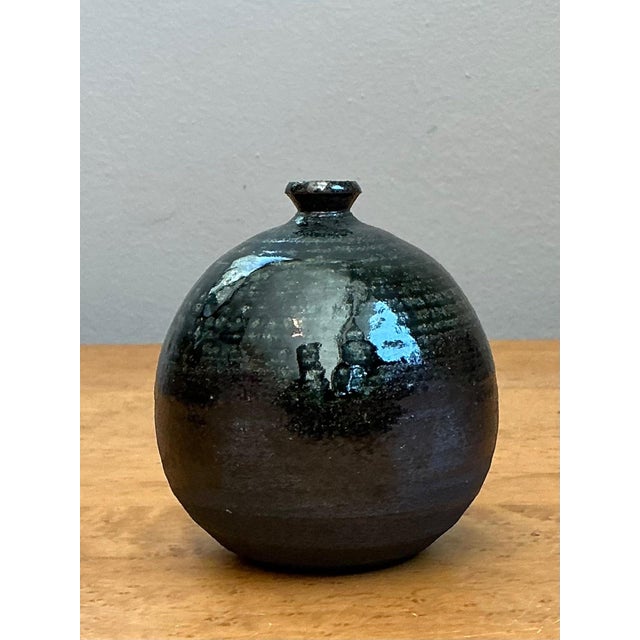 This vintage original studio pottery weed vase is a refined example of mid-20th-century ceramic artistry, where thoughtful...