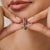A refined 925 sterling silver spinner eternity band featuring a vibrant combination of natural emeralds, rubies, and...