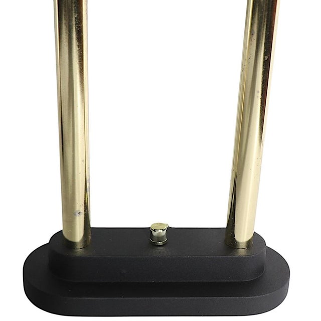 Chic pair of Post Modern, Art Deco Revival halogen desk lamps, in good, original working condition. The lamps feature...