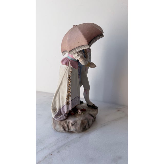 18th-Century Courting Couple Sharing a Parasol Under Pastel-Colored Period Attire. Glazed and Matte Porcelain Figurine For Sale - Image 10 of 15