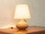 Beautiful ceramic table lamp from the 1960s. High-quality, hand-painted stoneware base with a cream-white lampshade....