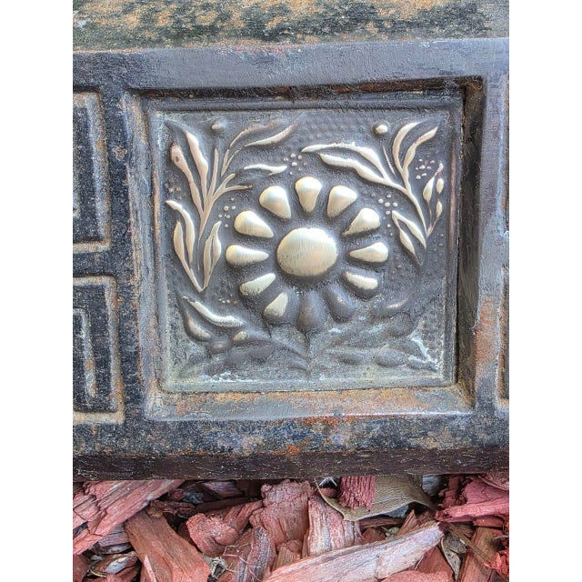 An exquisite vintage fireplace fender, measuring 51 x 11 inches, crafted from rich, aged metal and adorned with intricate...