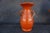 A rare Bauer Pottery “Carlton” vase in vibrant orange glaze, produced in Los Angeles in the 1930s. The sculptural form...