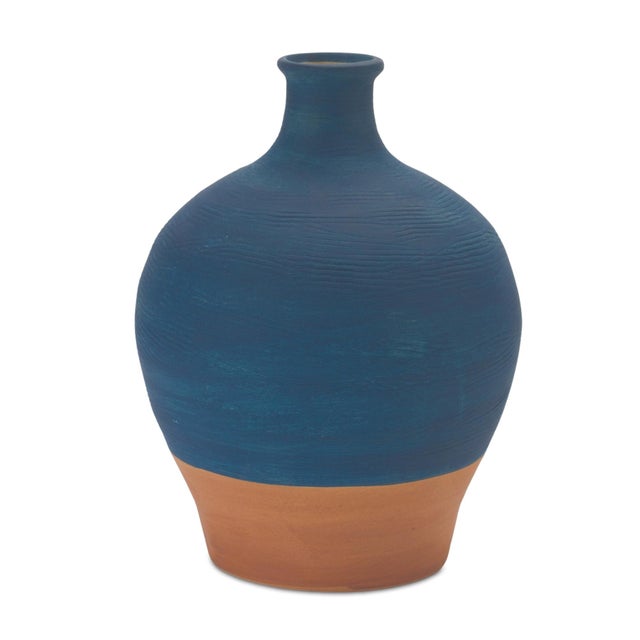 Add timeless charm and sophistication to your home with this 8.5" Ceramic Vase featuring a rich navy blue finish and a...