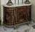 Bring timeless European elegance into your home with this grand French Louis XVI-inspired commode, featuring an impressive...