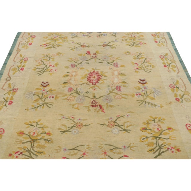 Handwoven in a wool flatweave and originating from Romania, circa 1950-1960, this 6x9 vintage kilim featuring floral...