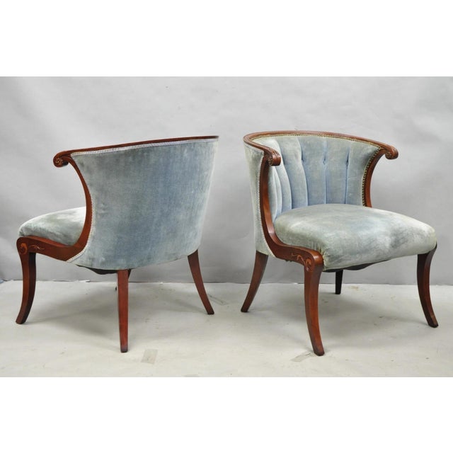 Vintage French Hollywood Regency Mahogany Saber Leg Barrel Back Parlor Lounge Chairs - a Pair. Circa Mid 20th Century....