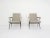 Black metal lounge chairs with new beige velvet upholstery. Designed by the Dutch Designer Friso Kramer for Ahrend de...