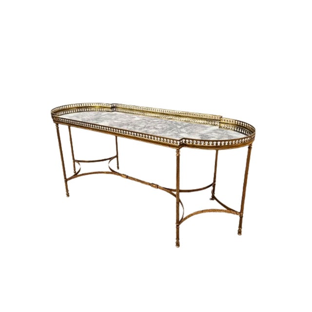 Mid-Century Baguès Style Oval Brass Coffee Table | Circa 1960 | Hollywood Regency A striking mid-century oval brass coffee...