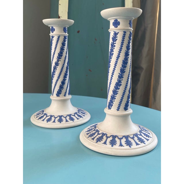 Description: A spectacular, highly collectible matched pair of 19th-century Wedgwood neoclassical candlesticks, explicitly...