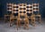 Elegant set of six solid oak dining chairs designed by Henning Kjærnulf and produced by Nyrup Møbelfabrik in the 1960s....