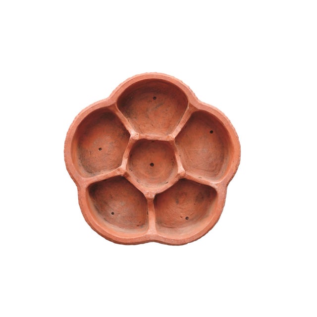 A large Italian plant saucer, made of terracotta, in a cinquefoil shape. Decorated around the lip in an egg and dart...