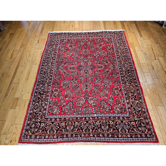 "A beautifully hand-knotted Persian Sarouk rug from the third quarter of the 20th century in rare near-square room-size...