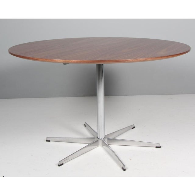Piet Hein and Bruno Mathsson super circular dining table with new top of walnut Legs of chromed metal. Model super...