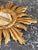 A finely executed contemporary interpretation of the classic European sunburst mirror, rendered with a sculptural...