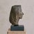 A cast bronze bust of a woman, signed by the artist and bearing the foundry mark Cire M. Pastori Perdue. Dating to the...