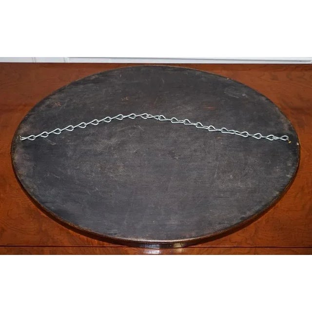 A beautiful antique Edwardian oval wall mirror dating from around 1910. This elegant piece features its original bevel-...