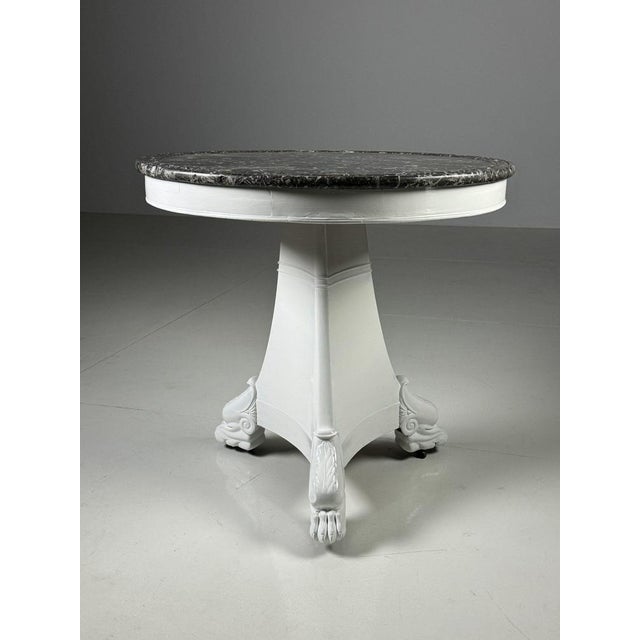 Early 19th century white lacquered Center table / coffee table. Originally from France. with anthracite “Saint Anne”...