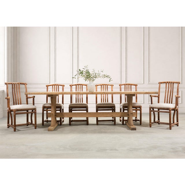 An elegant set of eight dining chairs crafted in the California organic modern coastal style by McGuire artisans. The set...