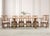 An elegant set of eight dining chairs crafted in the California organic modern coastal style by McGuire artisans. The set...