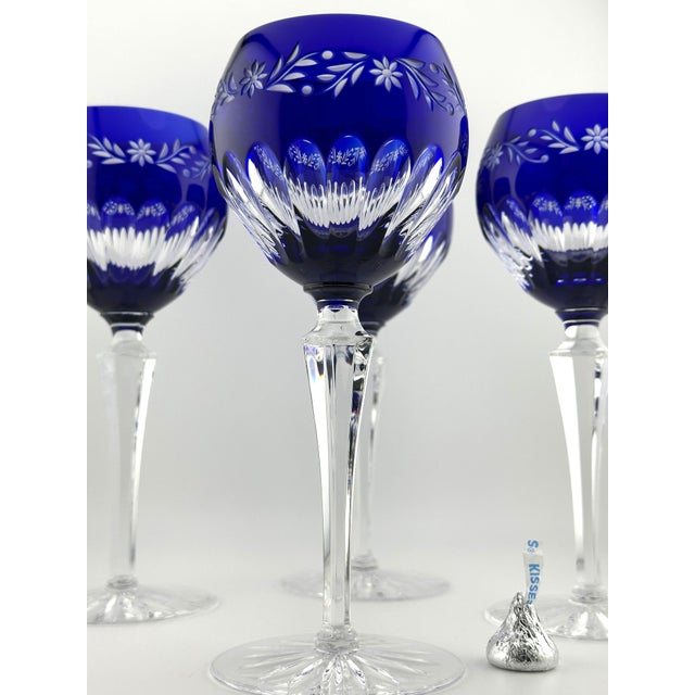 This elegant set of four cobalt blue cut-to-clear wine hocks was produced by Ajka Crystal, Hungary, marked Design Guild....